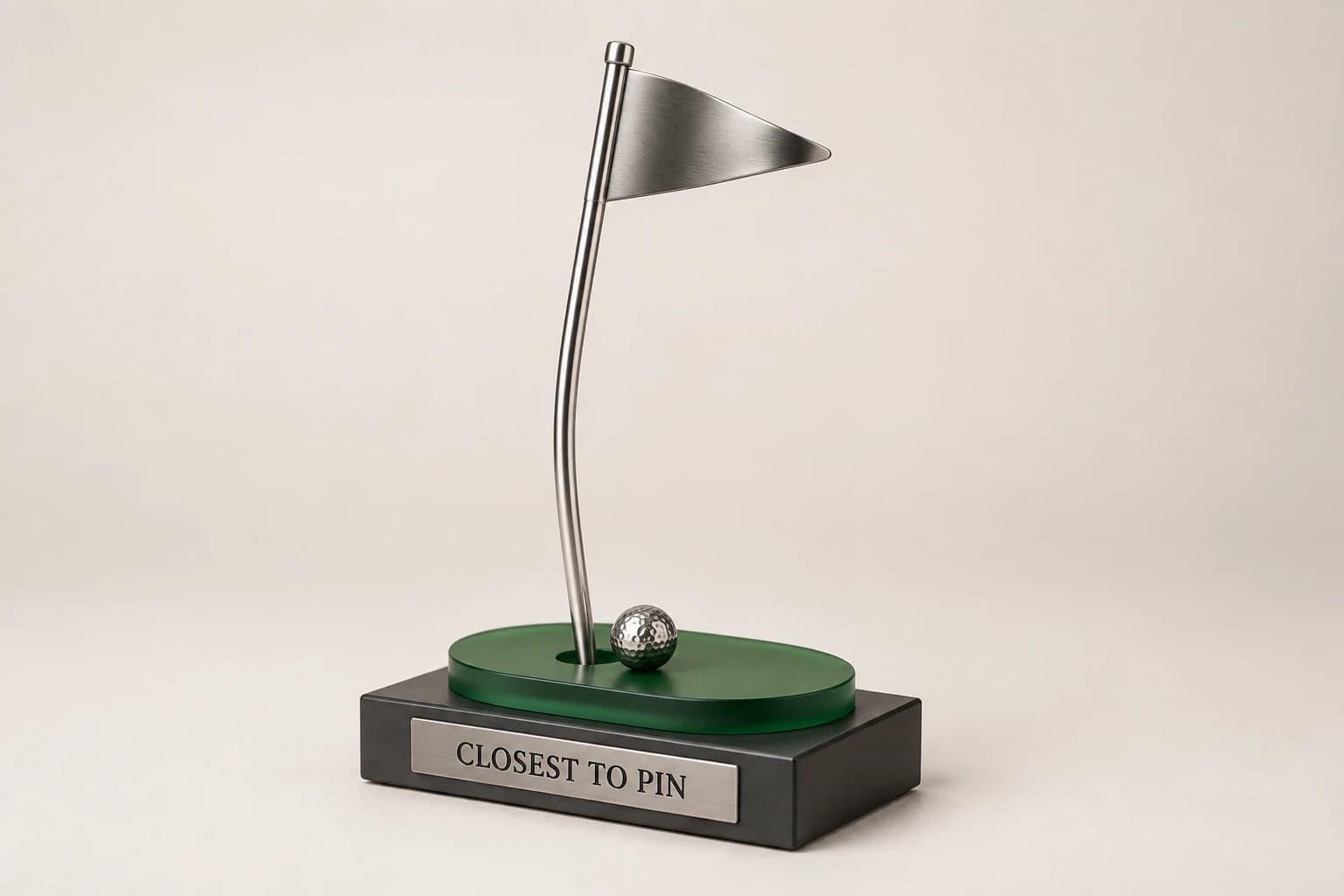 Silver flag-and-golf-ball skill award on a green acrylic accent.